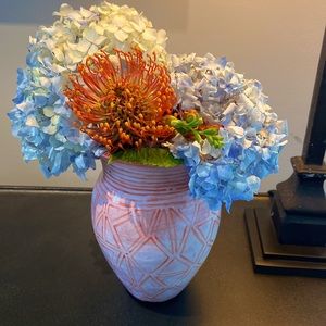 Orange and white pottery vase.